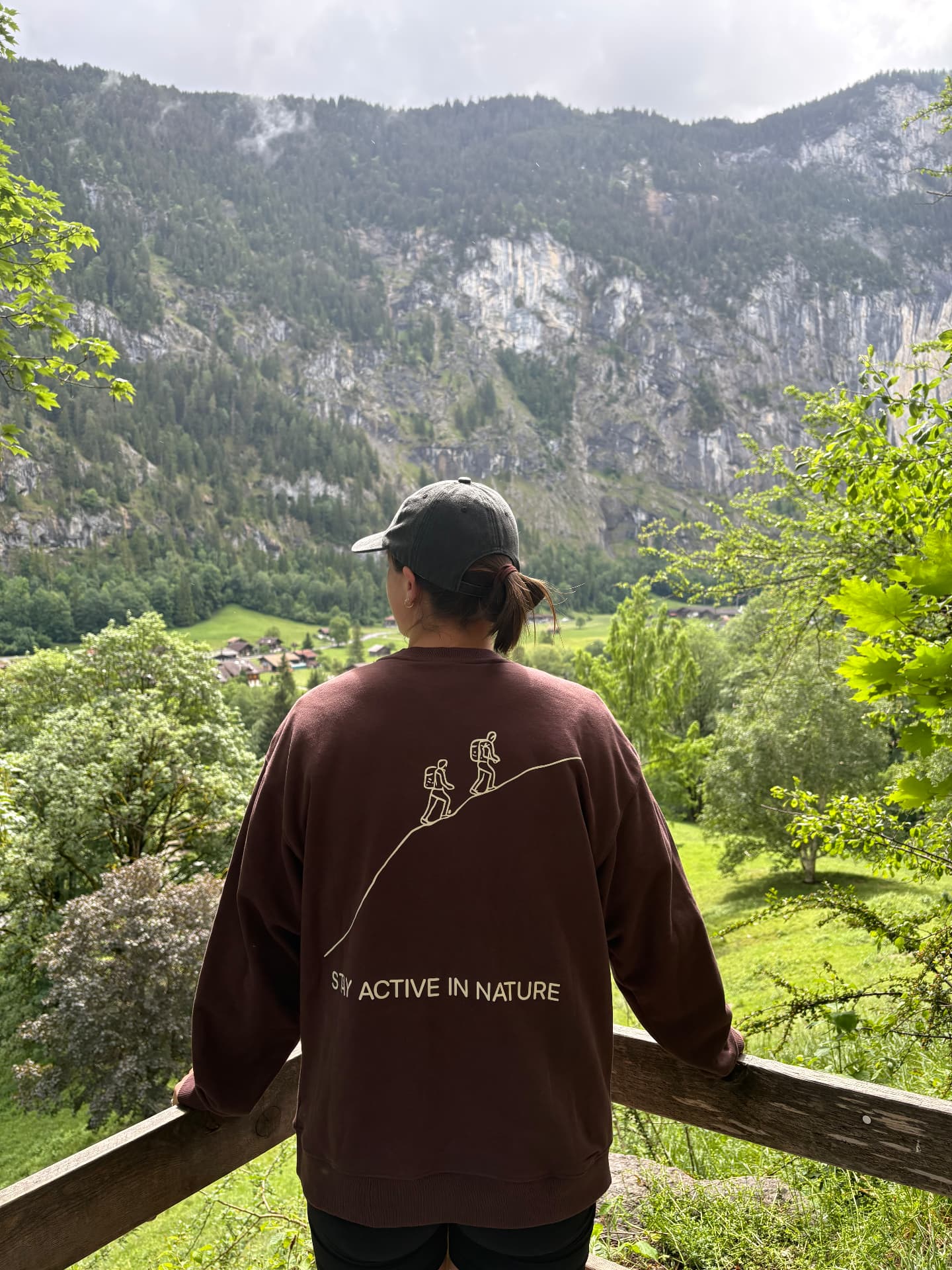 Aleisha Smith looking out over a mountain valley while hiking